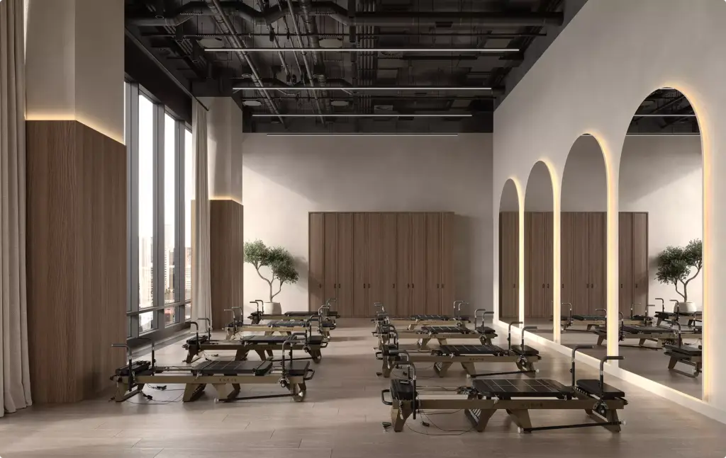 Pilates studio with reformer machines in 3D Interior Rendering and illuminated arch mirrors