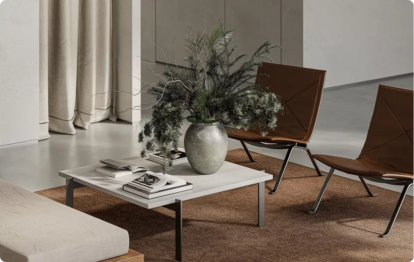 Interior render close up of coffee table with vase and greenery, books, chairs on rug in modern living space