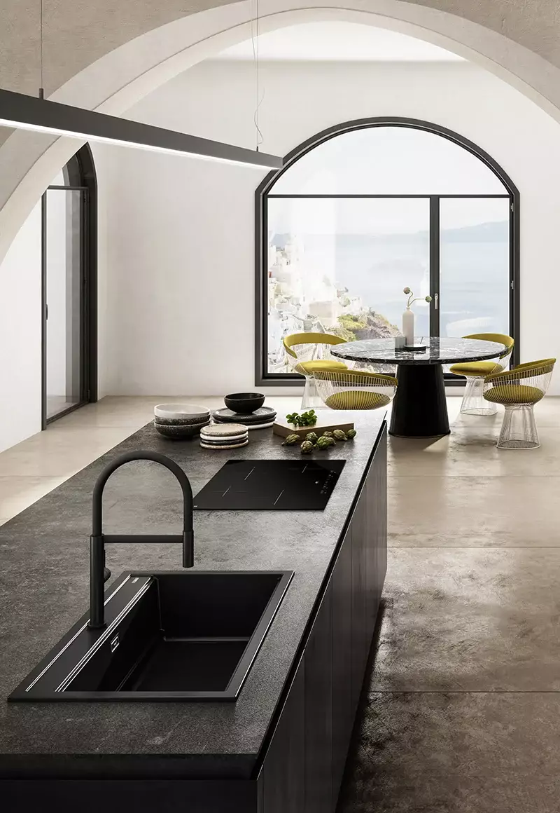 Best 3D Rendering Studios in Italy for 2026 Italian kitchen 3D render with arched windows, black island, dining table, and sea view