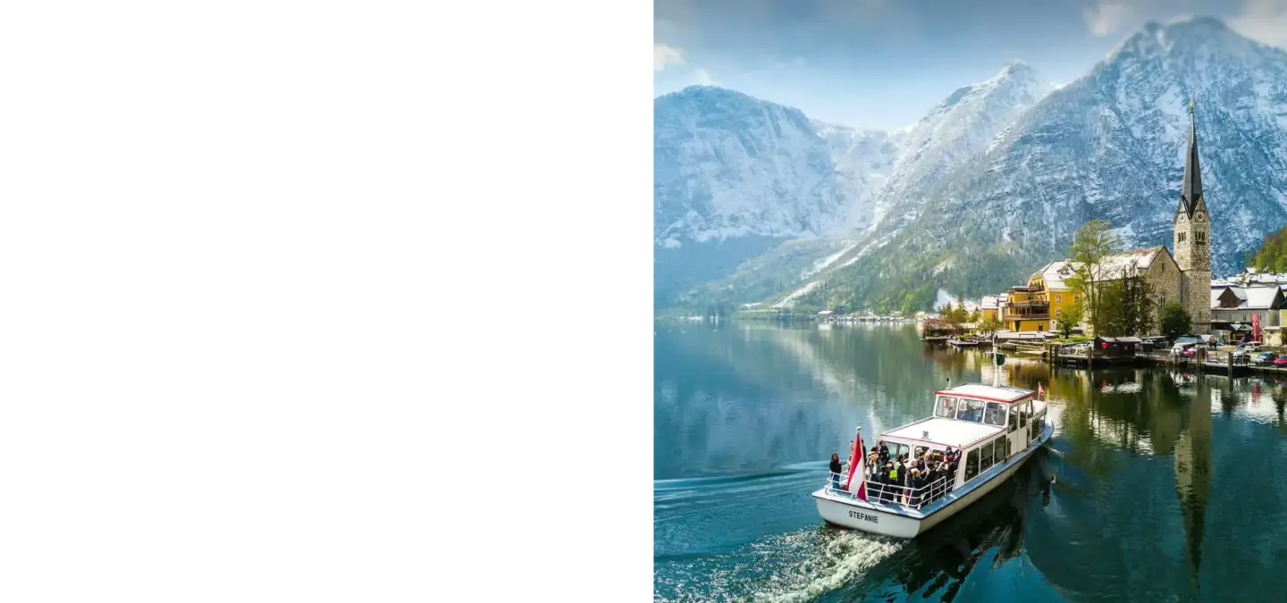 Boat on mountain lake near village, top 5 3D visualization companies in Austria