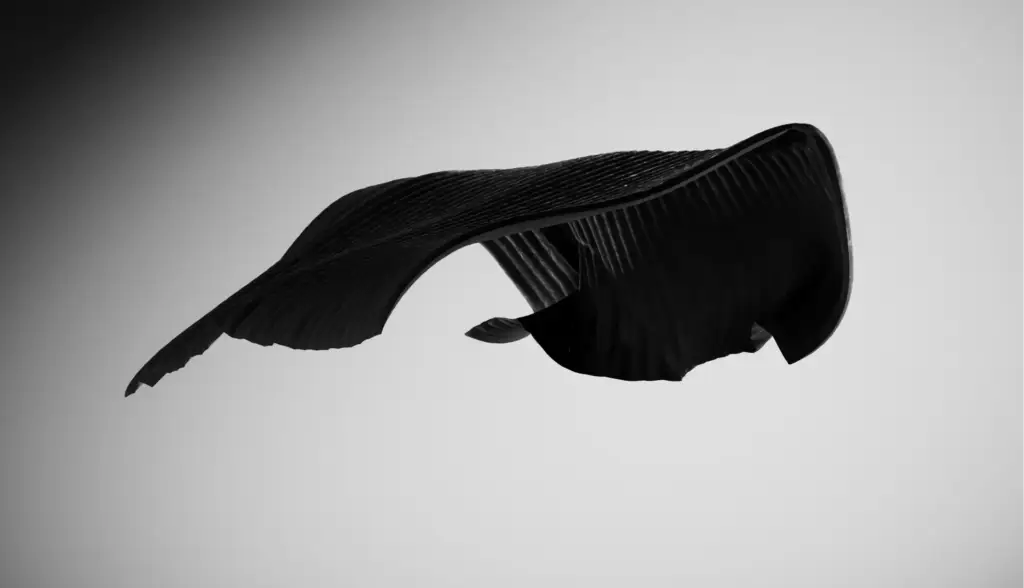 Animation for Sleep Accessories showing flowing black ergonomic sleep fabric in abstract motion