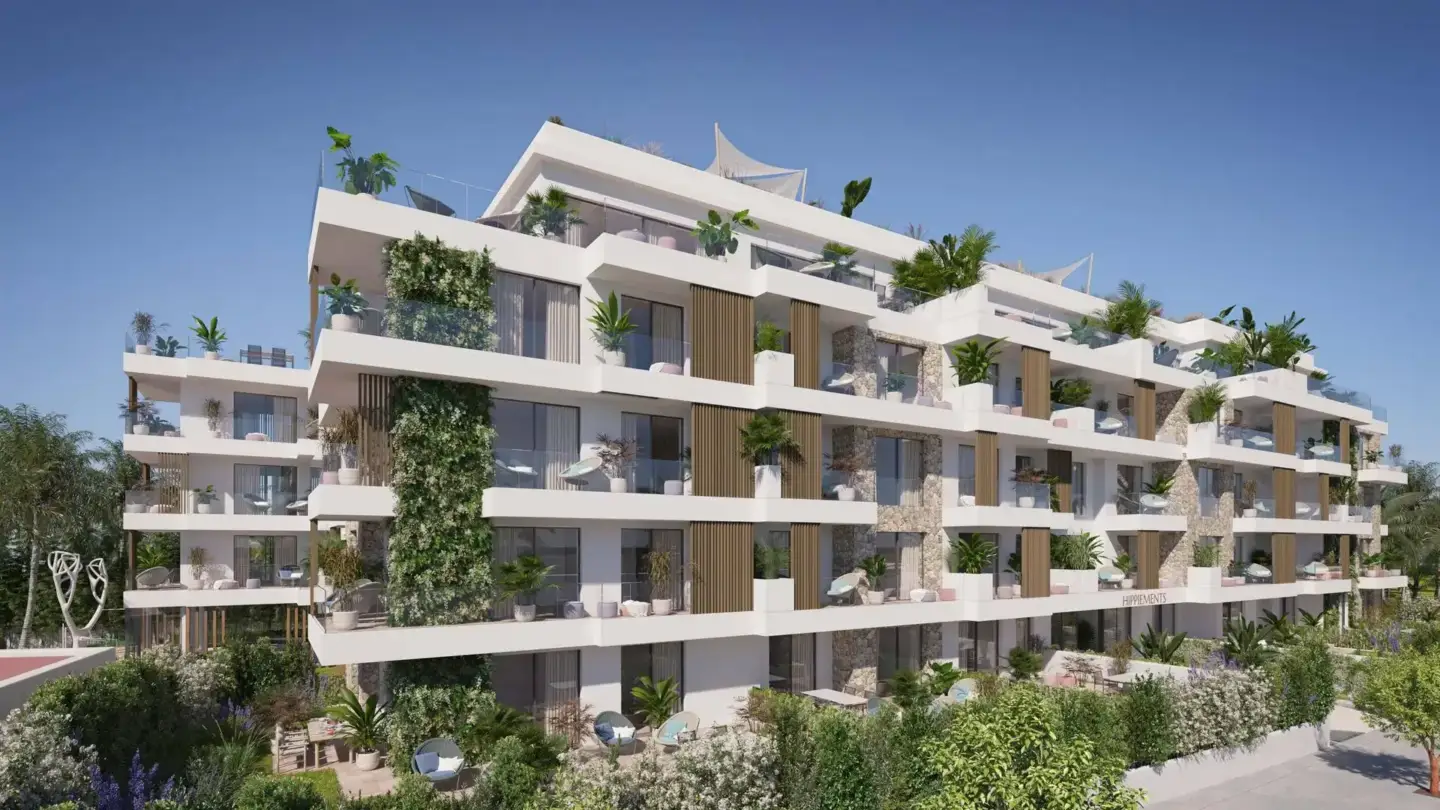 Best 3D Rendering Companies in Germany Modern residential complex with layered balconies, lush landscaping, outdoor seating, and stone facade details