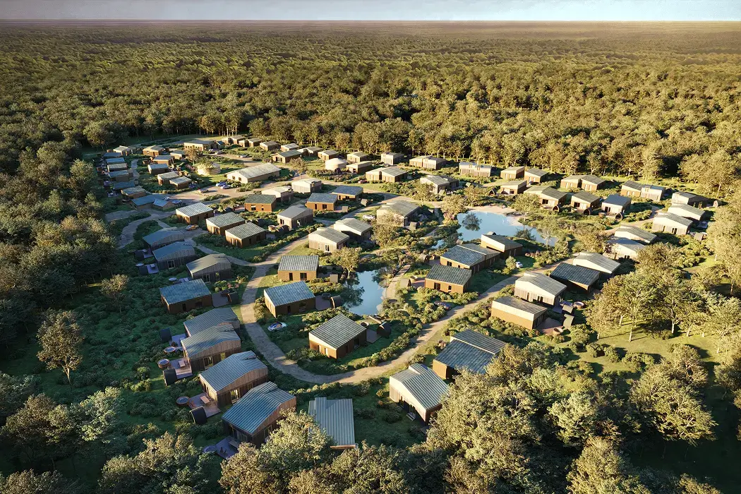 10 Best Architecture Blogs to Follow in 2026 Aerial view of sustainable housing masterplan integrated into forest landscape