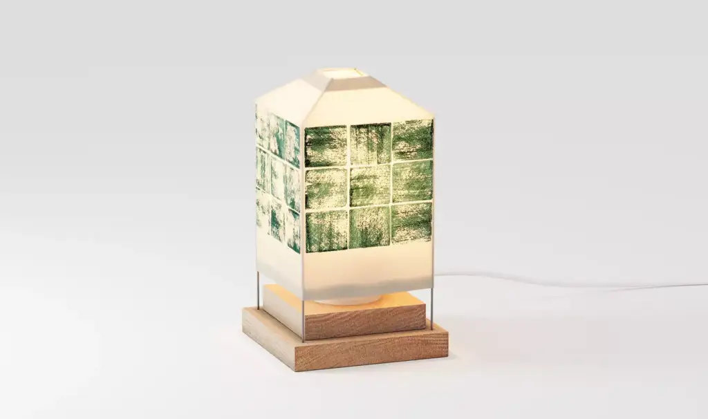 Modern geometric table lamp with green mosaic tile band and wooden base isolated on neutral background for 3D product visualization