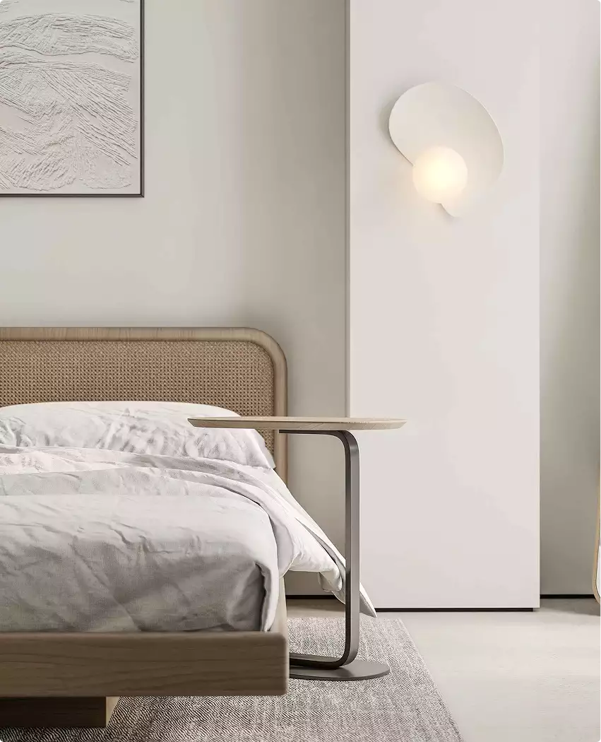 3D tour apartments bedroom corner with upholstered bed, side table, wall light, and neutral tones