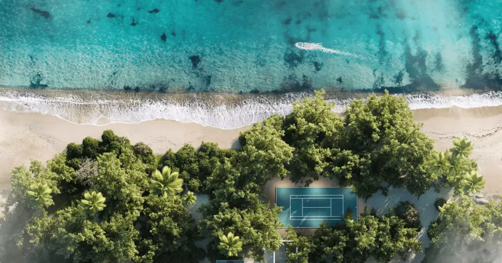 Aerial 3D rendering for hotel marketing shows beach, turquoise sea, boat, trees, and tennis court