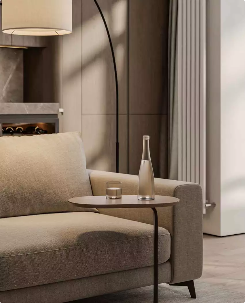 Apartment 3D tour sofa corner with side table, bottle, glass, floor lamp, and warm neutral finishes