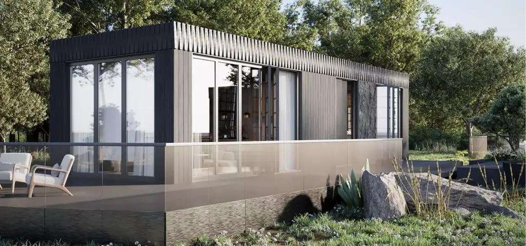 Modular home exterior design with dark cladding, tall glass walls, and terrace railing