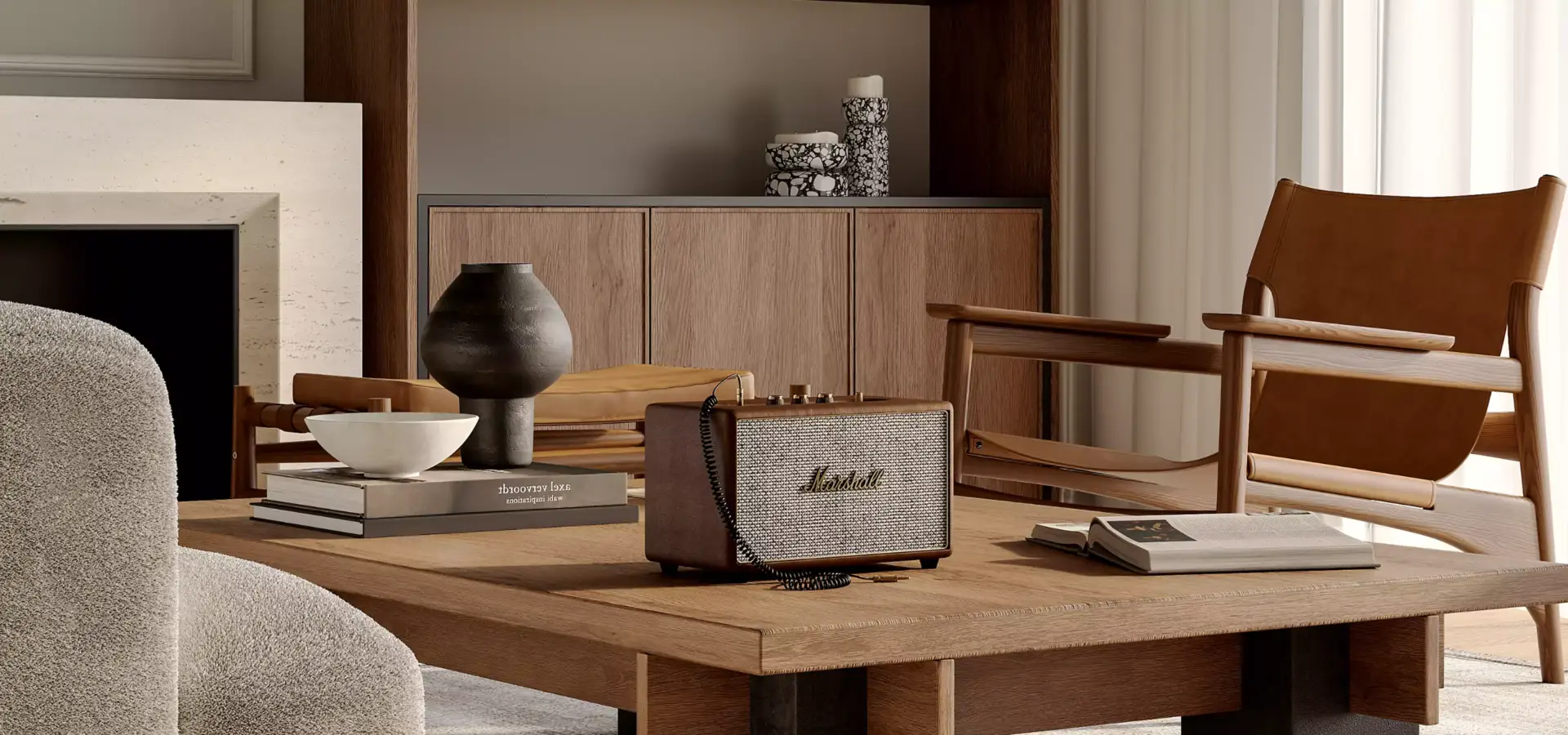 3D product rendering service example showing speaker on wooden coffee table with books, decor, and lounge chairs