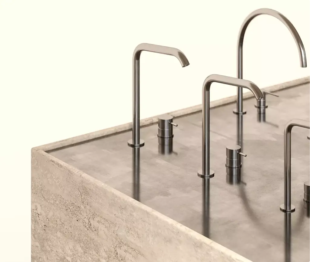 Close view of faucet display in sales booth rendering with stone counter and metal fixtures