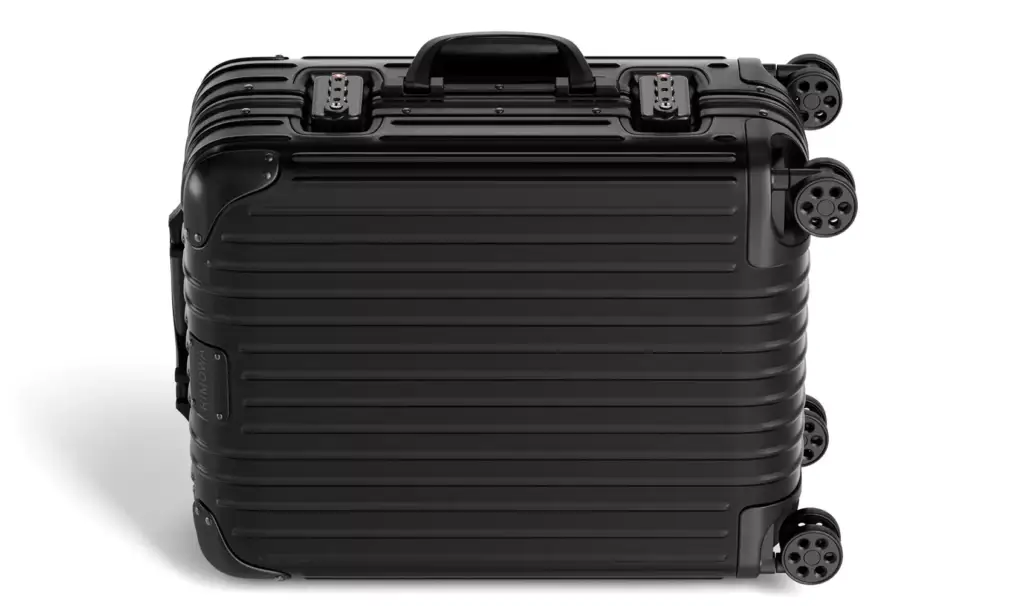 Suitcase 3D model showing a black hard-shell case laid flat with four wheels visible