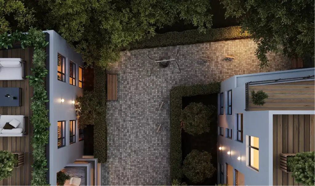 3D architectural rendering for developers aerial view of courtyard with greenery, paths, and building edges