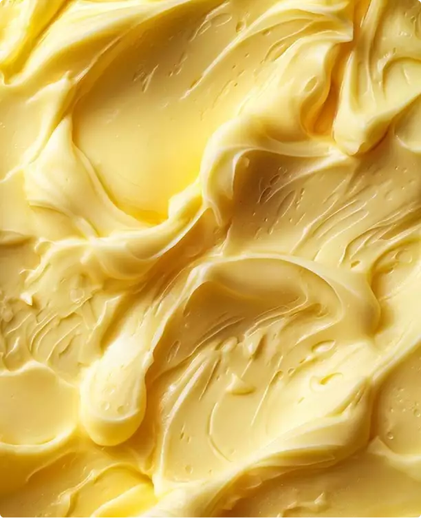 3D cosmetic creamy yellow texture spread with smooth swirls and highlights filling frame