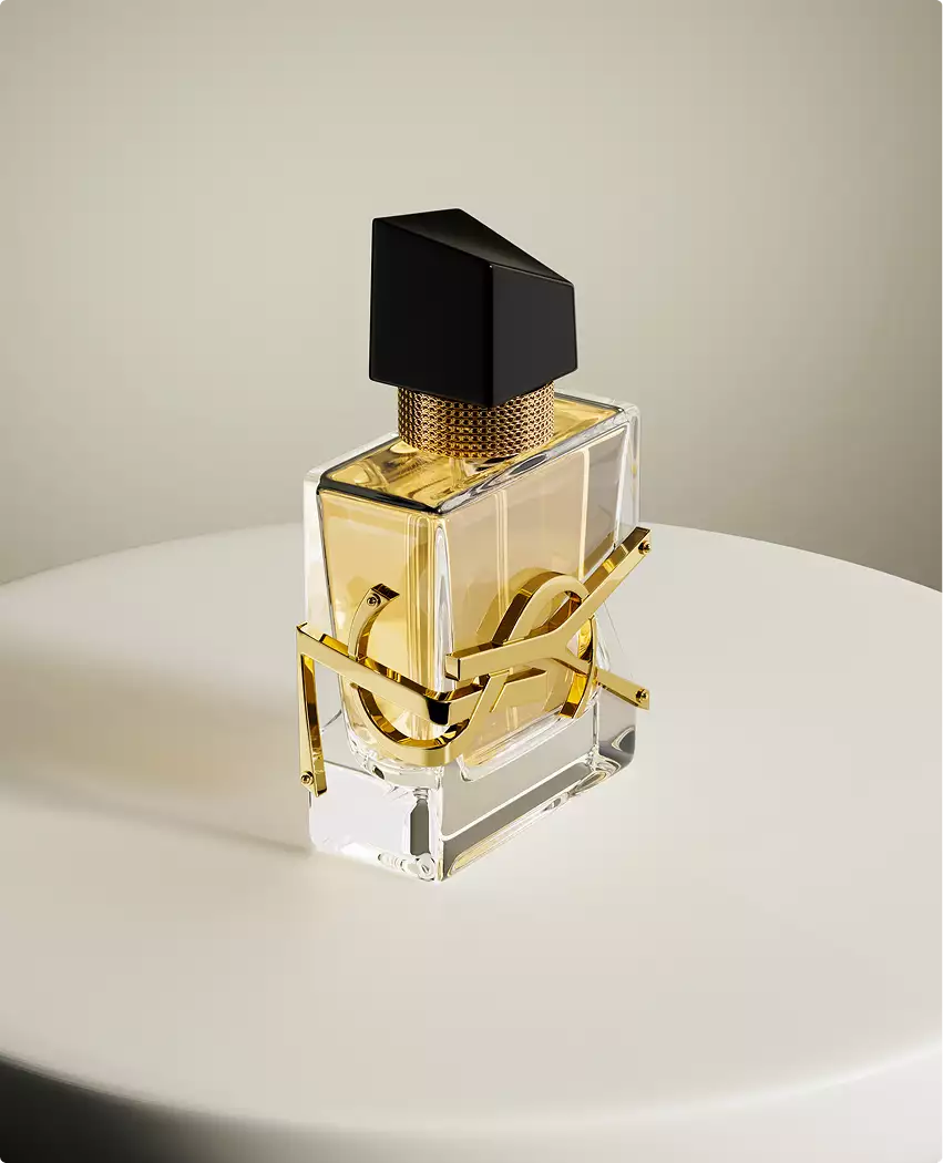 3D cosmetic perfume bottle angled view with gold accents on soft neutral background surface