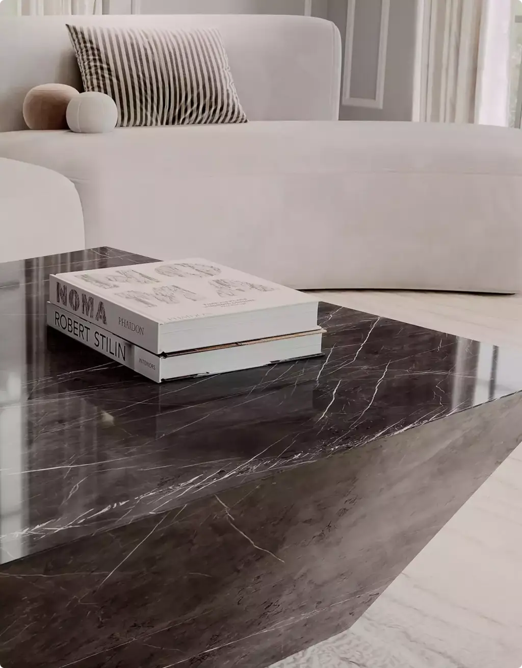 3D Furniture Rendering Portfolio dark marble coffee table beside white curved sofa