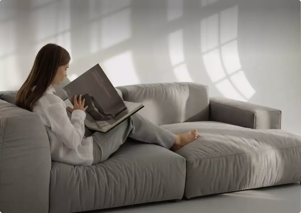Woman reading book on soft sectional sofa in bright living room with window shadows, 3D furniture rendering