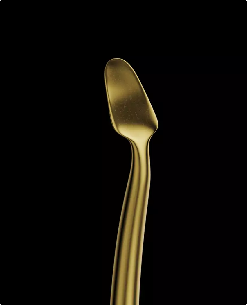 Dental tool head closeup in 3D medical animation video on black background with gold reflective surface