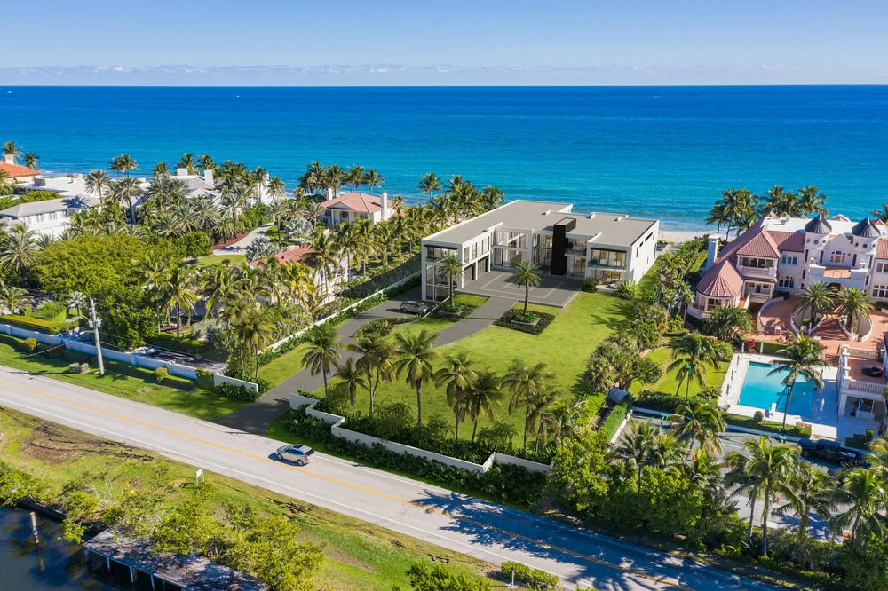 Best 3D Rendering Companies in Miami & South Florida for Luxury Real Estate in 2026 Waterfront mansion 3D rendering Miami aerial view with ocean, palm trees, and luxury estate