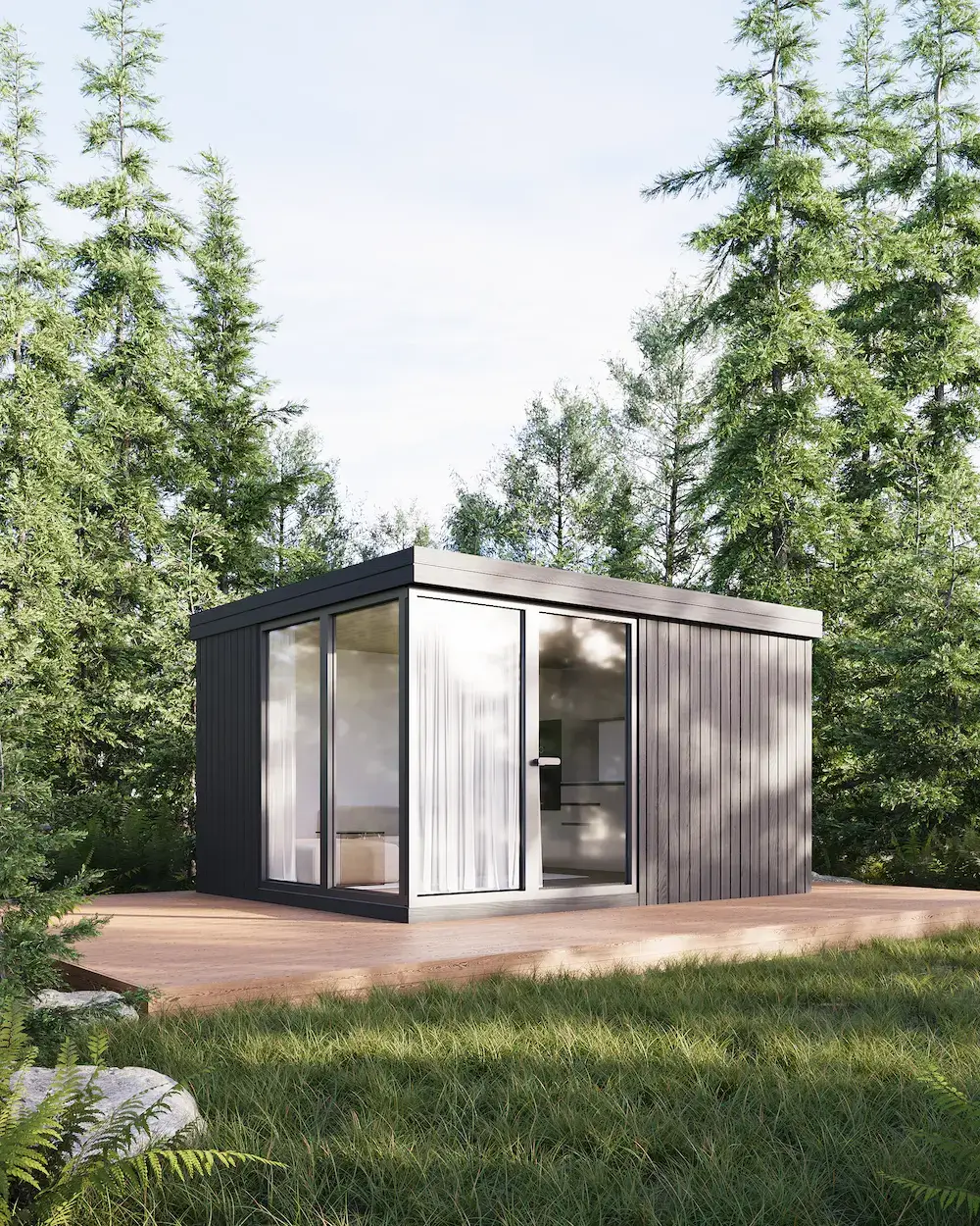 What Is Modular Housing? A Clear Definition and How It Works Compact modular home with full-height glass and dark cladding in a forest setting