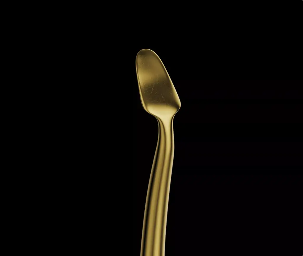 Animation For Dental Innovation showing gold dental instrument tip on black background