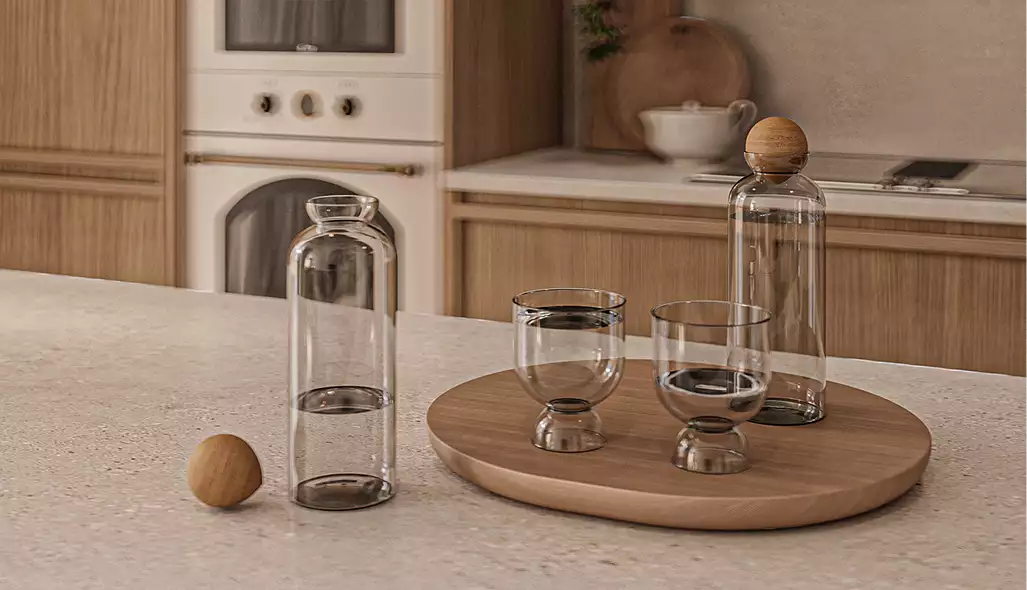 Kitchen counter with glass bottles and wooden tray, apartment interior design