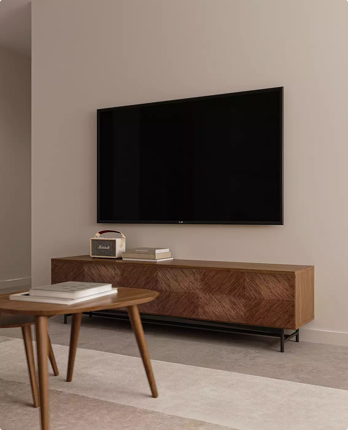 Living room in apartment interior with wall mounted TV, wood console, and decor items