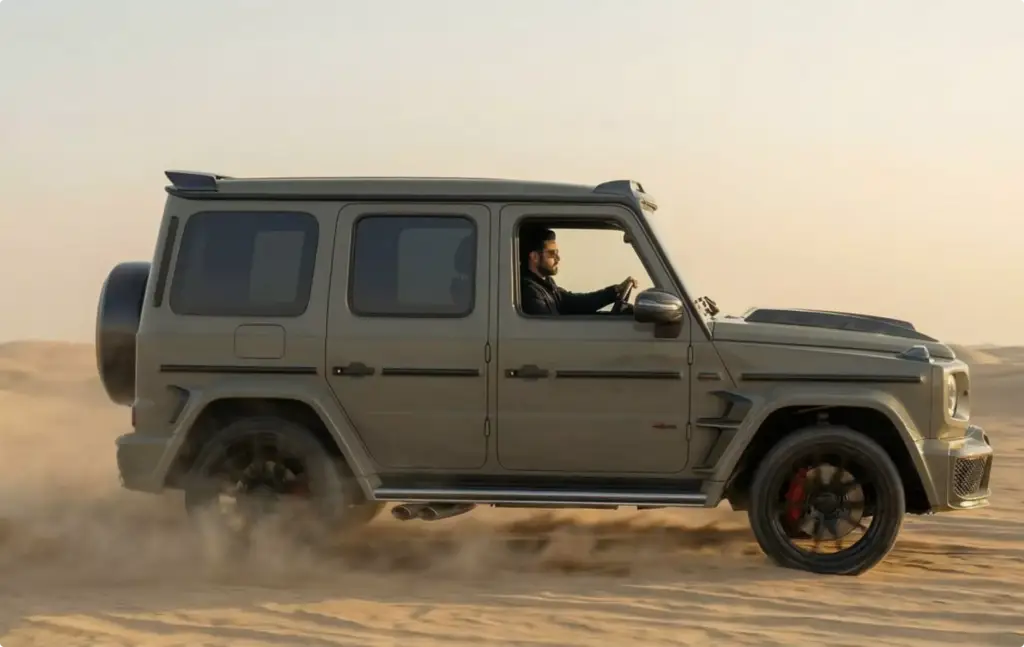 Mercedes G-Class driving across desert with dust trail, Automotive Rendering Service