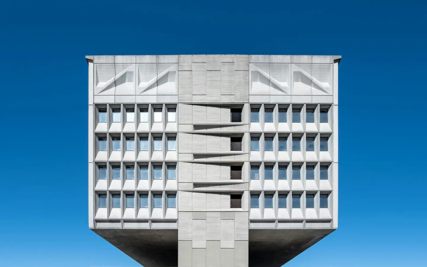 What Is Brutalist Architecture, and Why Is It So Controversial? brutalist architecture example with exposed concrete and geometric facade