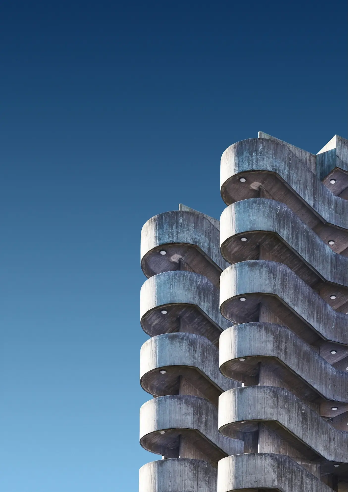 What Is Brutalist Architecture, and Why Is It So Controversial? brutalist residential building with repetitive concrete balconies