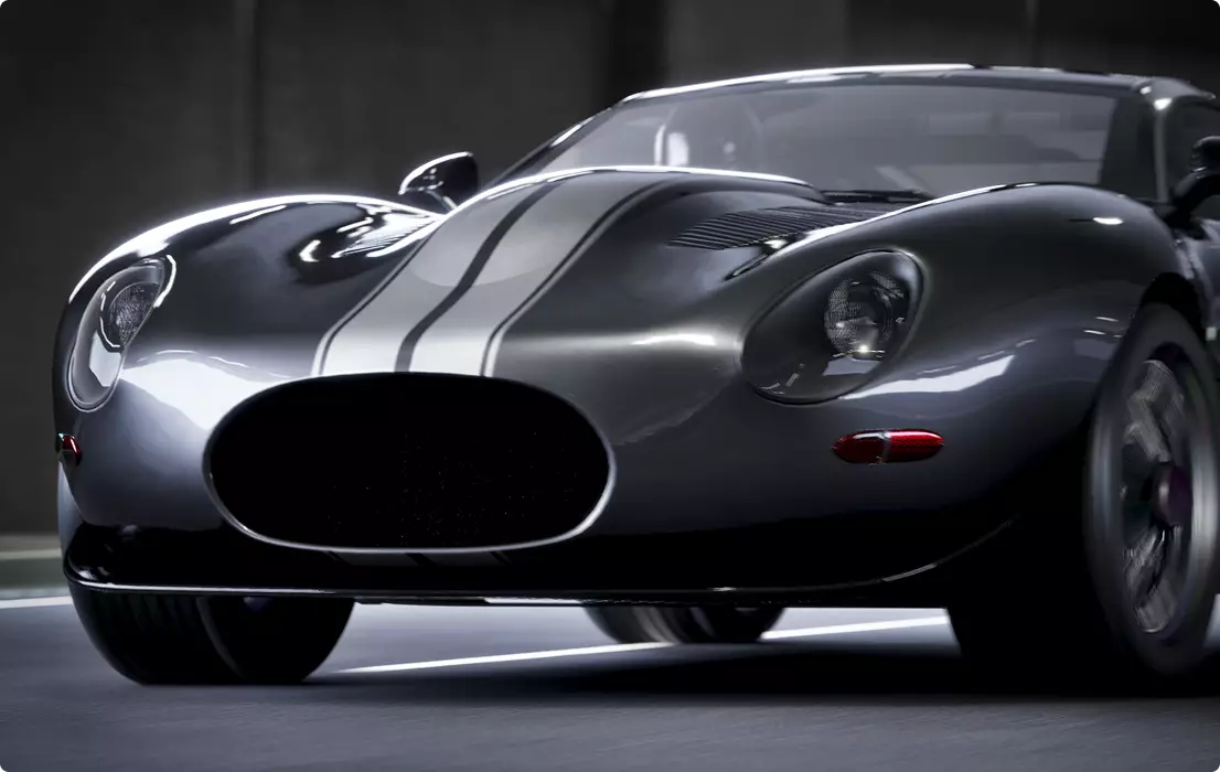 Car design close-up of gray sports car front with racing stripes, round headlights, and low grille