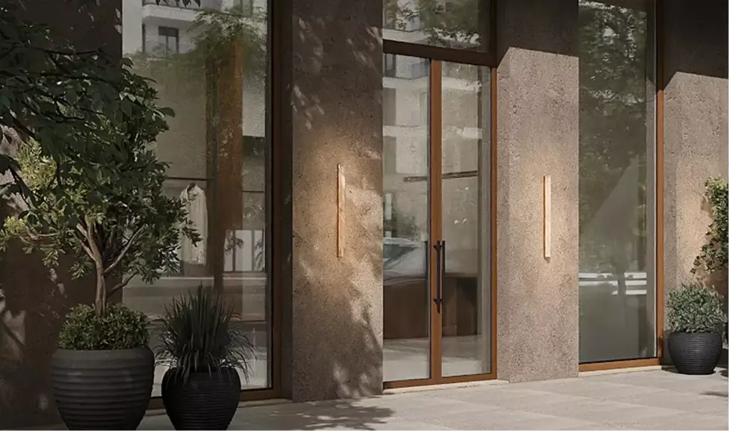 Commercial exterior rendering with glass entrance, wall lights, and greenery in planters
