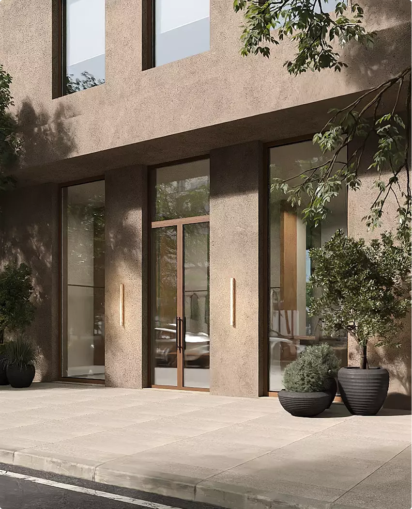 Commercial exterior rendering with stone facade, glass doors, and potted plants along sidewalk