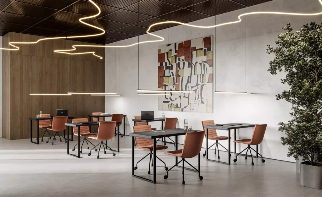 Meeting area fitness center architectural design with desks, chairs, and abstract wall art