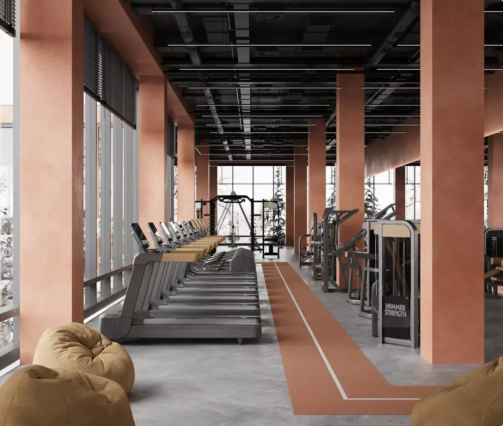 Modern gym cardio area fitness center interior design with treadmills, weight machines, and large windows