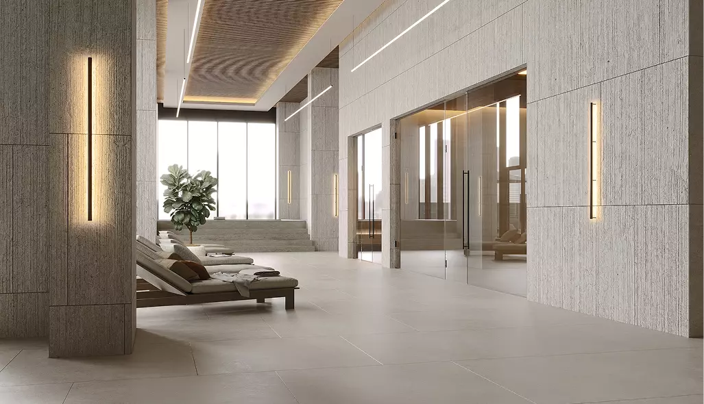 Spa lounge fitness club interior design with recliners, stone walls, glass doors, and soft lighting