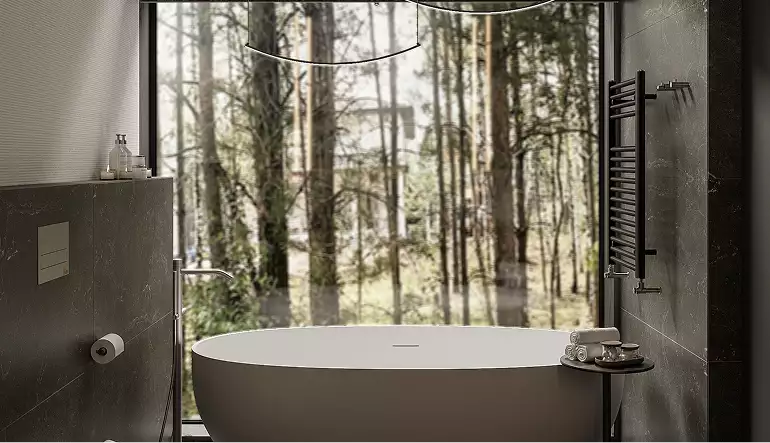 Modern forest house exterior bathroom with freestanding tub and large window facing tall forest trees