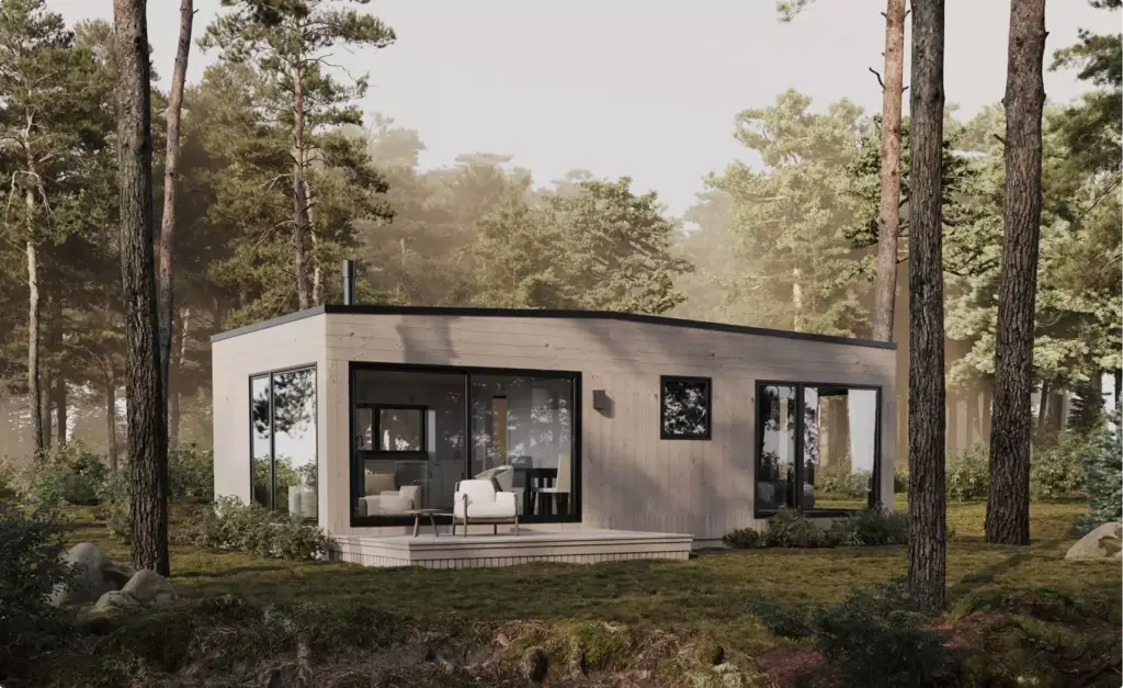 Modern forest house exterior with wood siding, large glass doors, and deck among tall pine trees