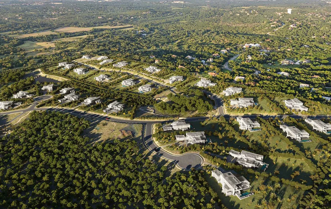 Aerial view of master plan residential community with roads, houses, and green landscape