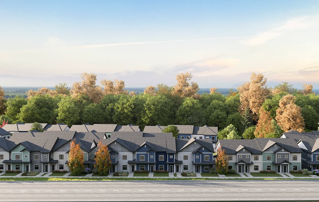 Row of houses in master plan community street view with trees and distant landscape
