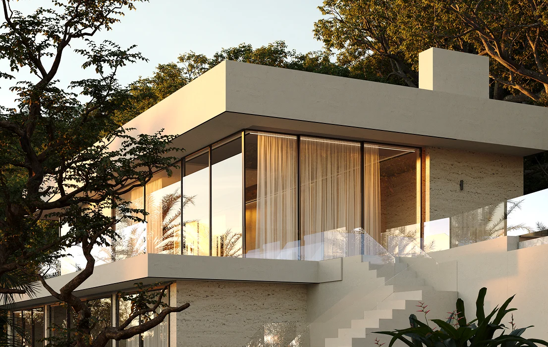 Modern master plan home at sunset with large windows, balcony, and surrounding trees