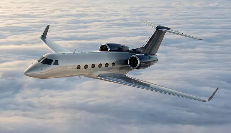 Gulfstream G450 airplane design jet cruising above clouds with sunlight on fuselage and twin rear engines