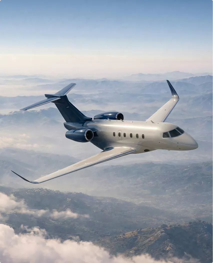 Gulfstream G450 new aircraft design jet flying above mountains with clouds and sunlight on fuselage
