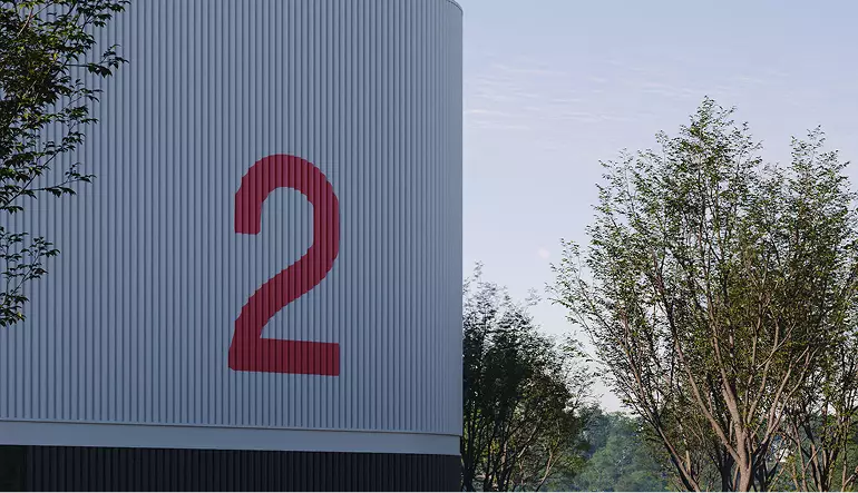 Logistics center rendering close up of warehouse facade with large number 2 and trees beside building