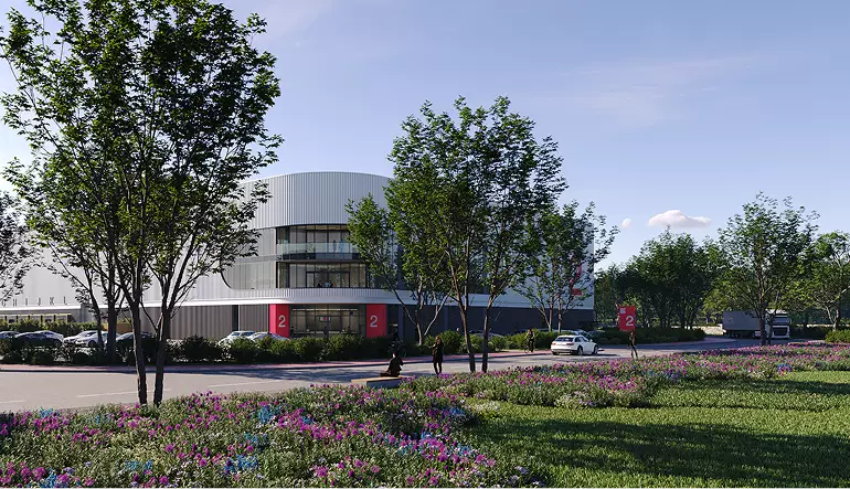 Logistics center rendering of modern warehouse with trees, road, cars, and people near entrance