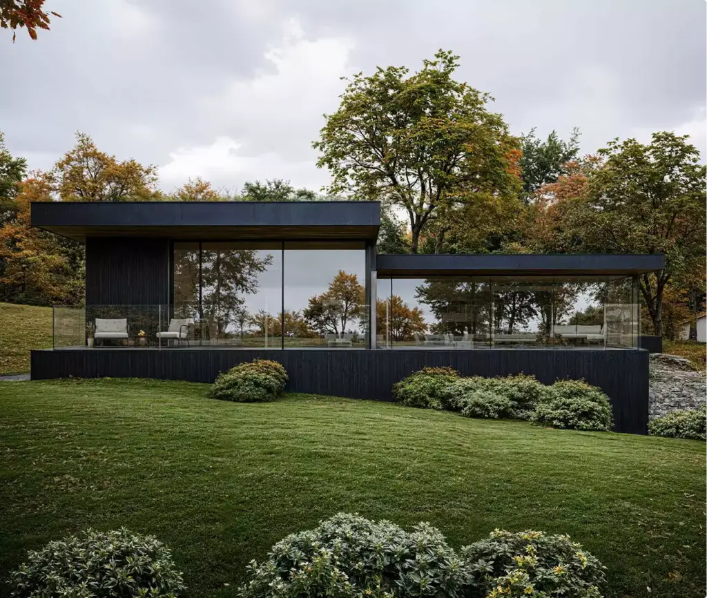Wide view of private house 3D rendering with flat roof, large windows and landscaped garden