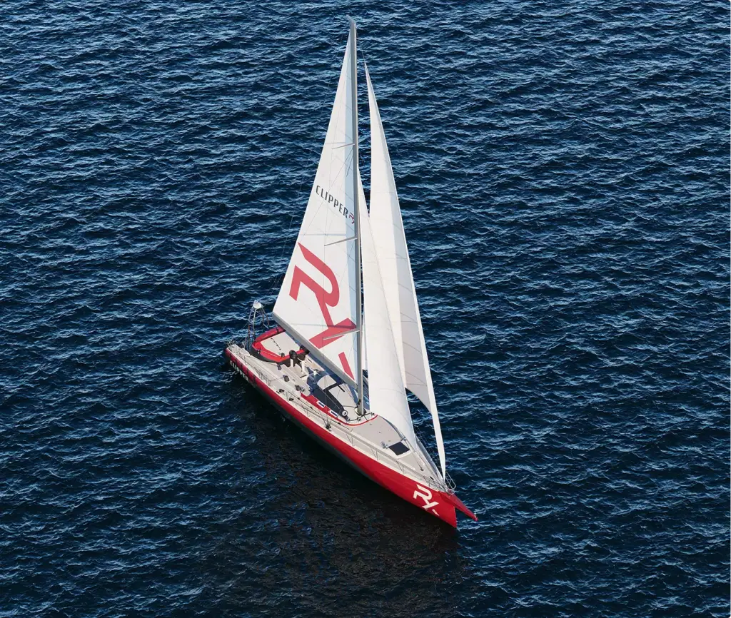 Sailboat 3D rendering aerial view of red and white sailboat on deep blue water