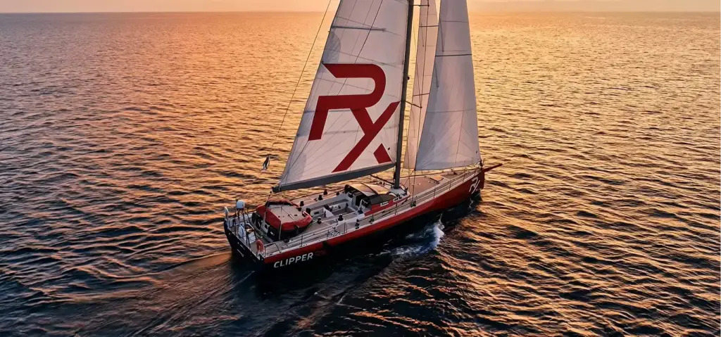 Sailboat 3D rendering at sunset showing the full vessel on the open ocean