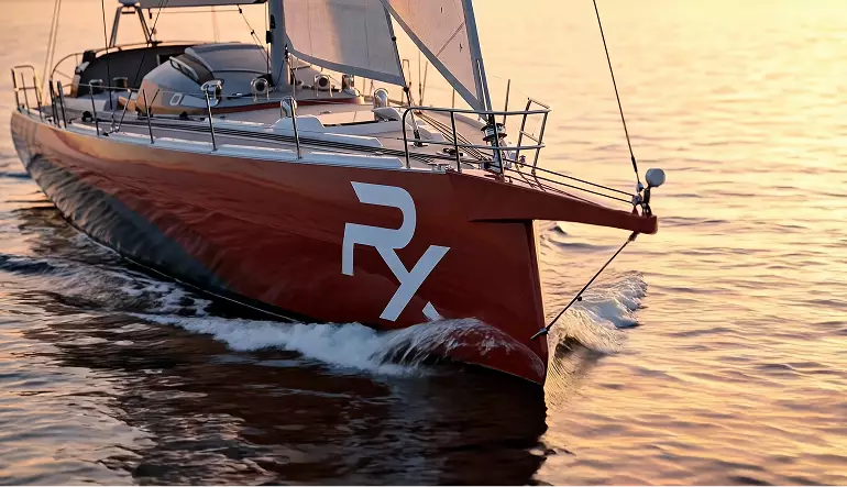 Sailboat visualization red bow cutting through water at sunset with small waves and white logo