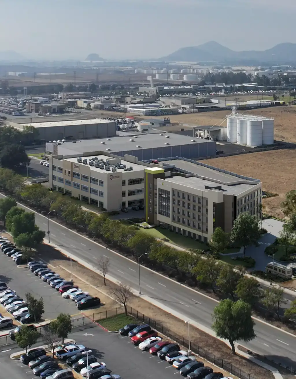 Industrial campus beside roadway and parking lots, Site Plan and Aerial Rendering Services