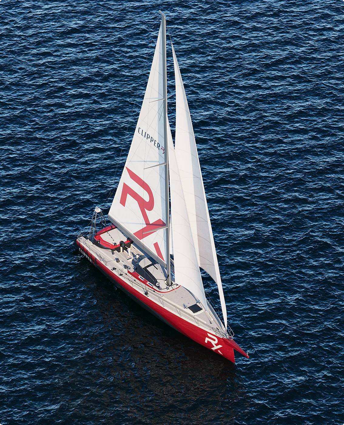 Aerial sailing yacht view in yacht rendering portfolio with white sails over blue sea